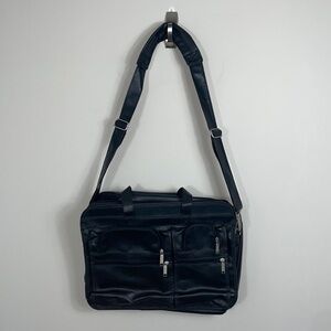 Soft bodied faux leather briefcase lots of pockets and crossbody strap